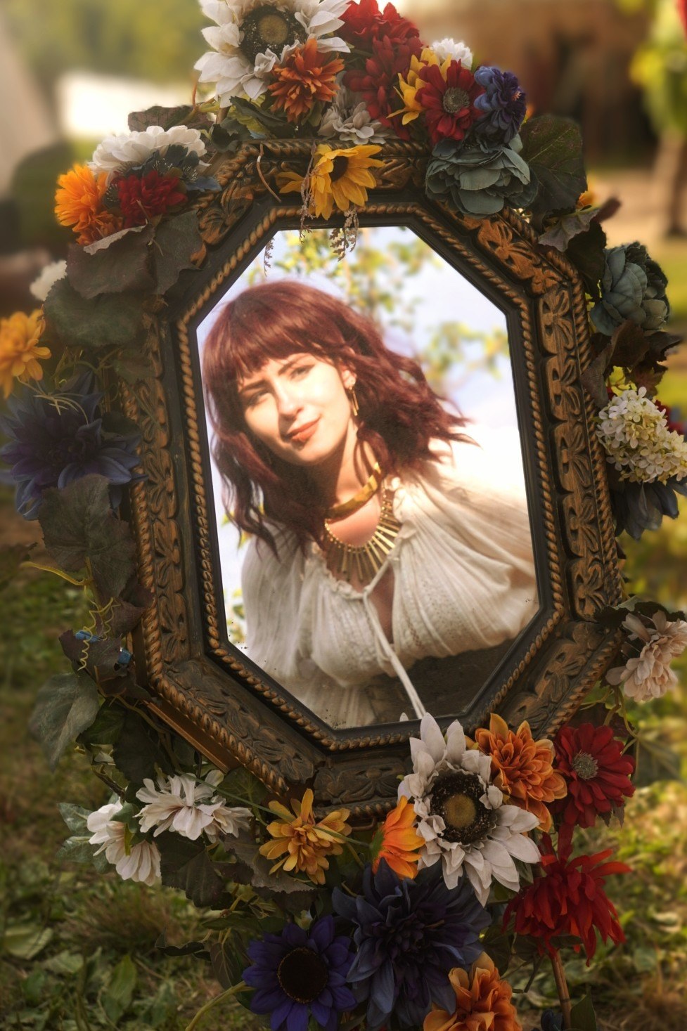 A reflection in an ornate frame